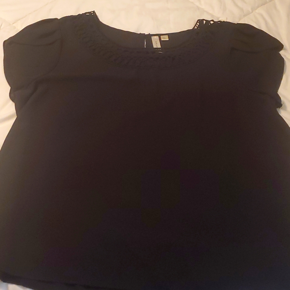 Tacera black blouse with tulip sleeves and crochet neckline.